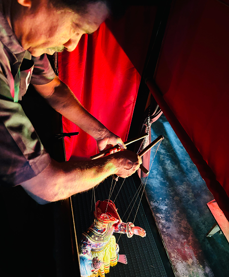 A traditional puppeteer at work
