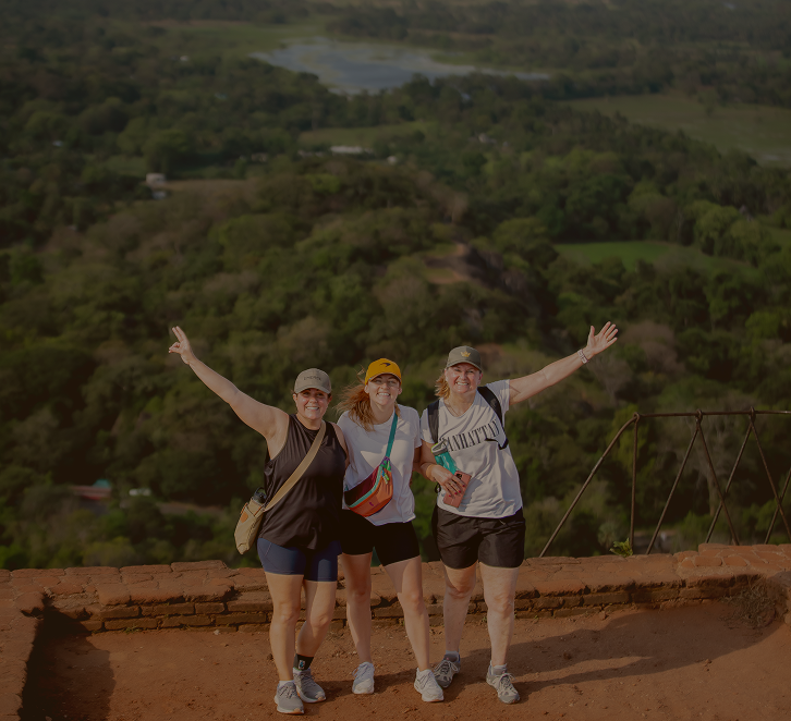 Travellers celebrating at a viewpoint